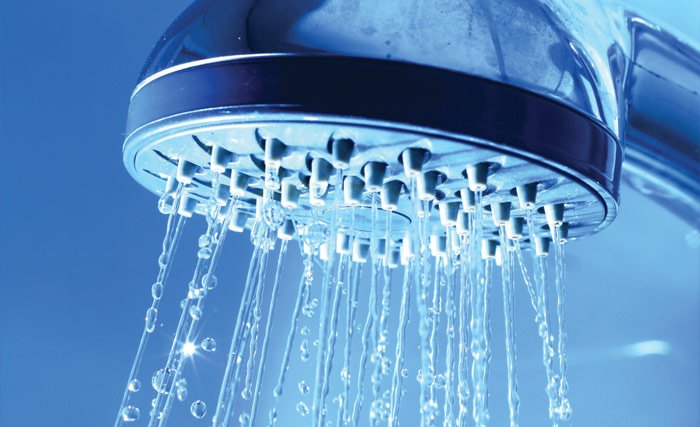 Photo of a free-flowing showerhead with no hard water scale or mineral buildup