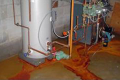 photo of leaking water heater due to accelerated corrosion