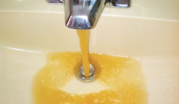 Water softening is needed for this brown, brackish water coming from a bathroom sink faucet.